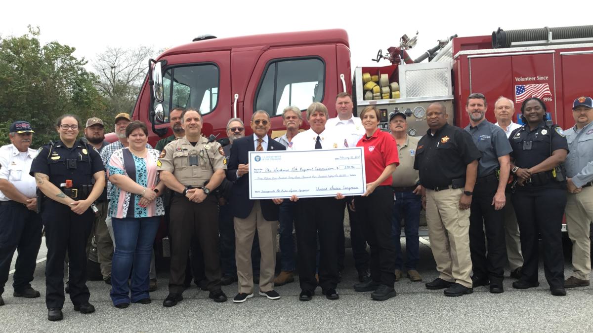 Congressman Bishop presents a ceremonial “big check” in Camilla, GA, representing the $3,941,986 he secured in federal funds for the Southwest GA Regional Commission to help local governments update their emergency communications equipment.