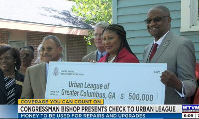 Congressman Bishop presents a FY22 Community Project Funding "big check" to the Urban League of Greater Columbus