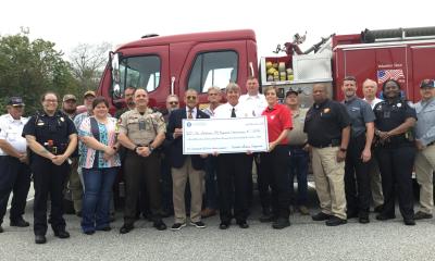 Congressman Bishop presents a ceremonial “big check” in Camilla, GA, representing the $3,941,986 he secured in federal funds for the Southwest GA Regional Commission to help local governments update their emergency communications equipment.