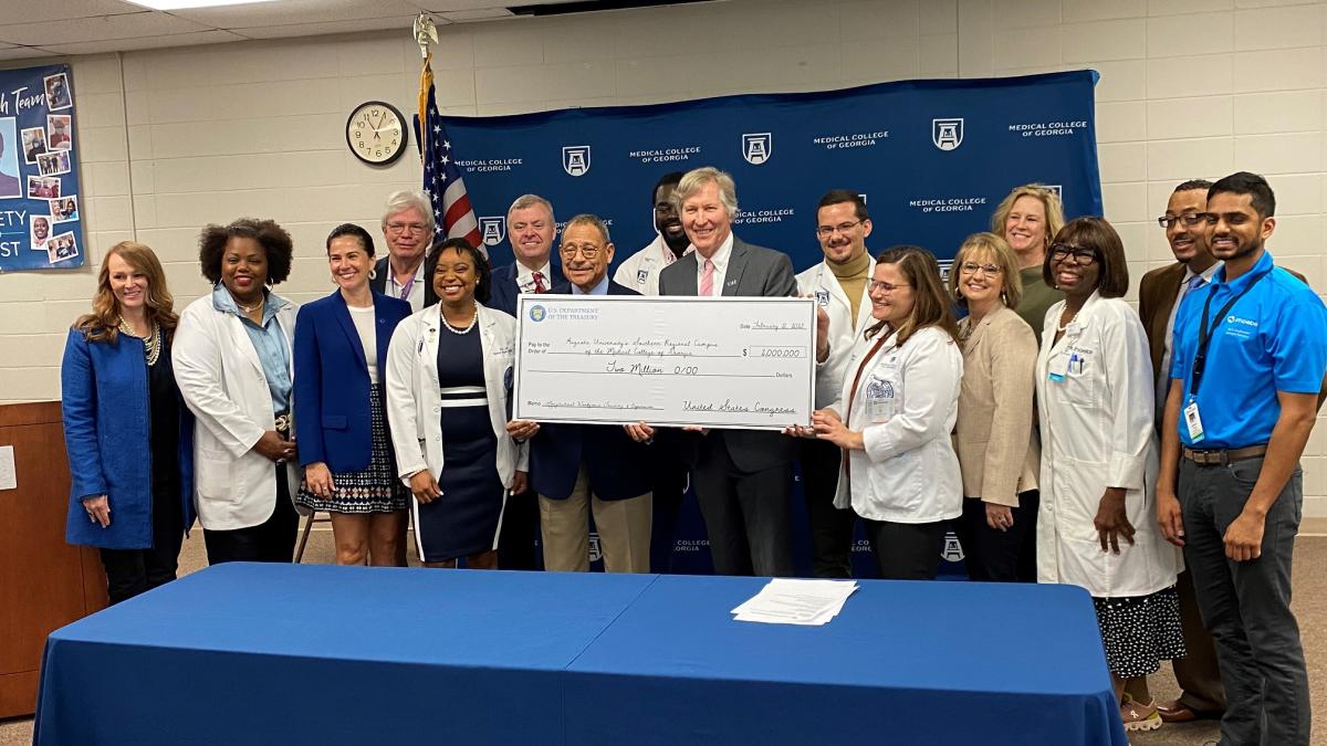 Congressman Bishop presents a ceremonial “big check” to Medical College of Georgia’s Dean David Hess, MD, in Albany, GA, representing FY23 federal funds for MCG's Southwest Campus